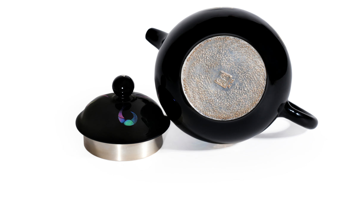 Nine Purple Fire silver teapot interior and lid